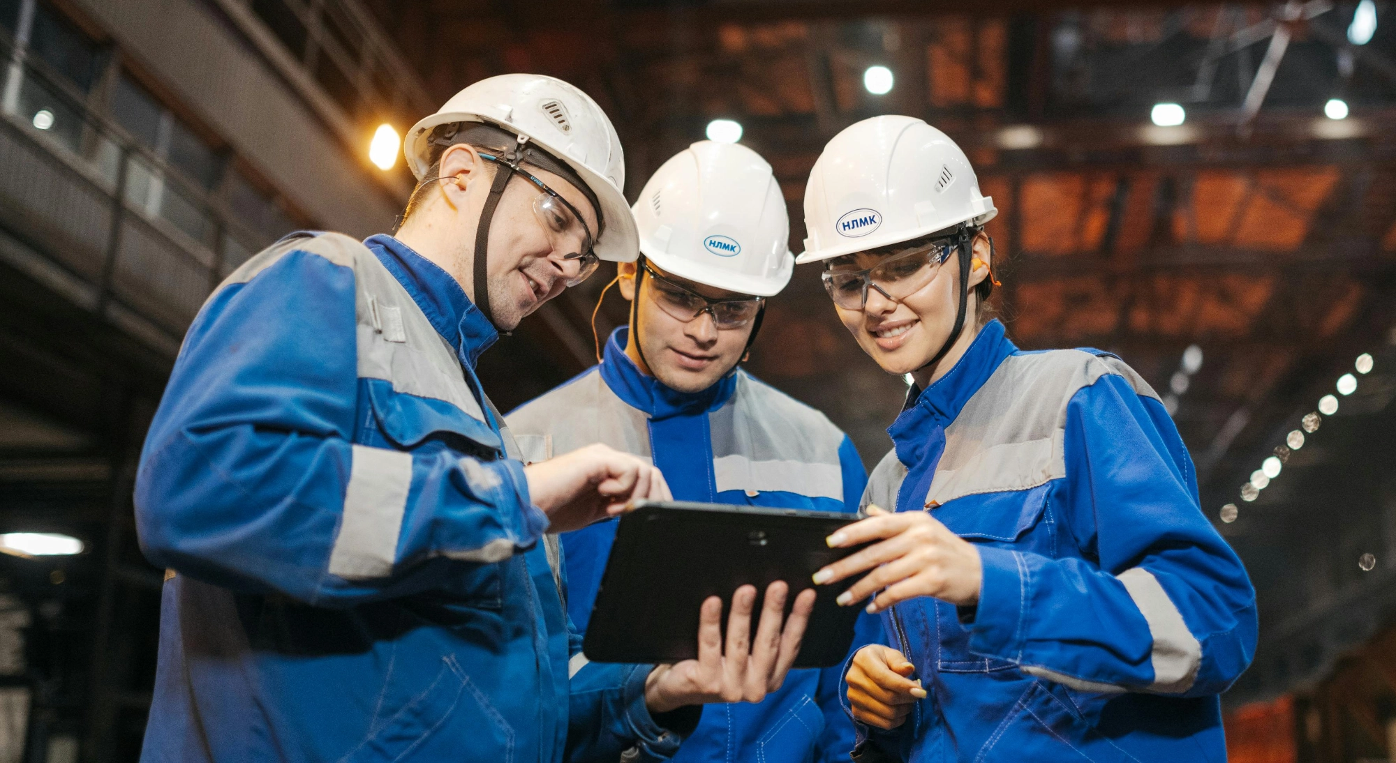 three engineers collaborating